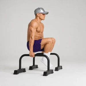 Tuck L-sit on parallettes with locked elbows and feet above the floor