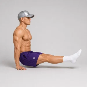 Floor L-sit with straight legs and palms flat on the ground