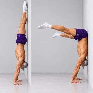 wall assisted straddle handstand press negative